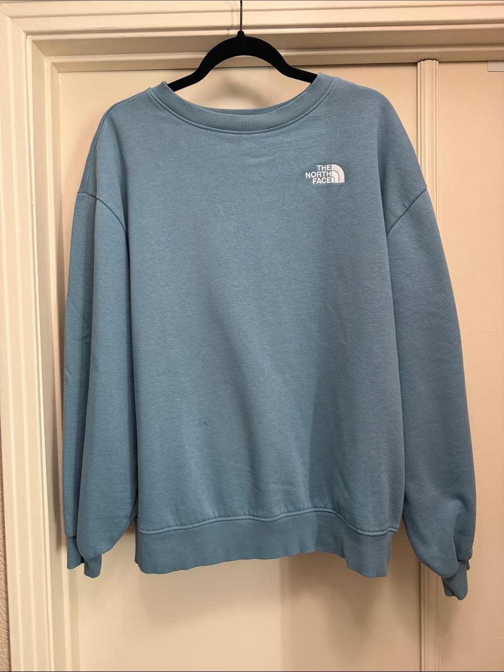 The North Face Women’s Dusty Blue Crewneck Sweatshirt. A few Ink Stains. Size L